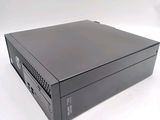 an image of a black desktop computer sitting on top of a white surface