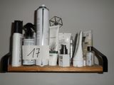 a shelf that has many different types of skin care products on it