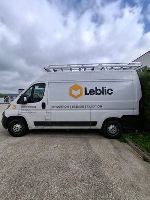 the white van is parked on the side of the road