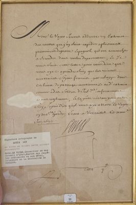 une photo d'un document manuscrit dans un cadre doré