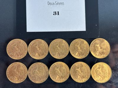 a close up of a bunch of gold coins sitting on top of a table