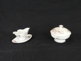 pair of antique porcelain creamers and saucers