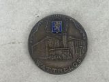 a coin with a picture of a building on it