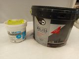a bucket of paint and a cup of ice cream on a table