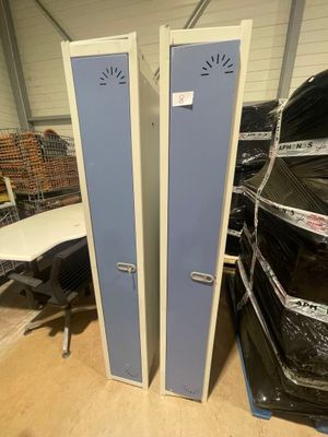 two lockers that are sitting in the middle of a room