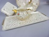 a picture of a tea set on a tray on a table