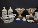 many different types of vases and bowls on the table
