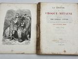 un vieux livre avec le dessin d'un homme et d'un lion