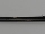 a pen that is laying on a white surface