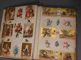 an open book with pictures of people and flowers on it