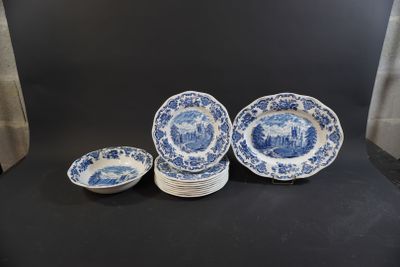 a group of blue and white plates sitting on top of a table