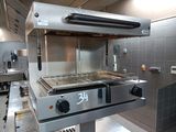 an image of a commercial kitchen with stainless steel appliances