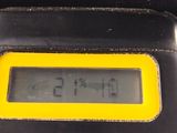 a digital clock on the back of a black car