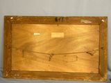 an old picture of a wooden frame with a picture on it