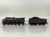 two toy trains that are sitting on a white surface