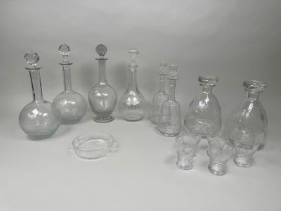 a lot of glass bottles that are sitting on a table
