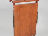 an image of a wooden clothes rack with a hanger on it