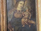 une peinture ancienne représentant une femme tenant un enfant sur ses genoux