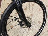 a close up of a bicycle parked on a tiled floor
