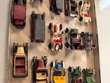 many toy cars on display on the wall