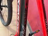 a close up of a bike with a red frame