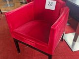 a red chair that has a price tag on it