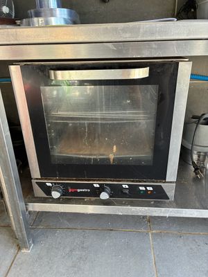 a toaster oven sitting on a counter in a kitchen
