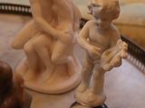 several figurines are sitting on a tray in a living room