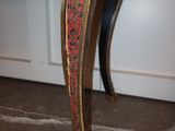 a table that has a red and gold design on it