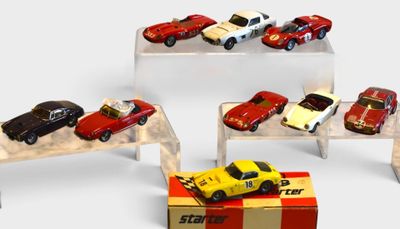 several toy cars are on display in a display case