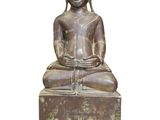 an image of a statue of a person sitting on a box