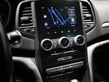the dashboard of a car with a gps device in the center of it