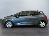 the grey car is parked on the concrete floor in the room