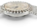 a close up of a watch on a white surface