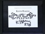 a black and white photo of a sign with graffiti written on it