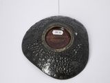a picture of a black stone with a picture on it