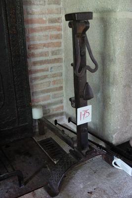 a black iron fire place with a sign on it
