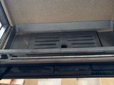 a stove that has a grill inside of it