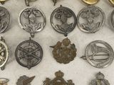 a close up of a table with a bunch of badges on it