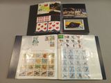 a lot of different stamps on a table together