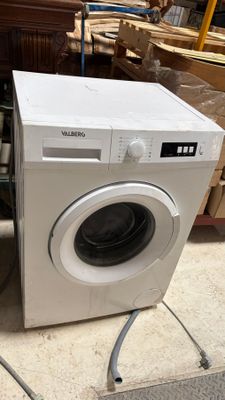 a washing machine that is sitting on the floor