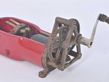 a small red box with a wine opener on it