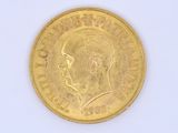a gold coin with a picture of a man on it