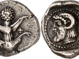 a silver coin with an image of a bird and a bird on it