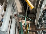an overhead view of a metal structure with a yellow handle