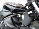 a close up of a motorcycle parked on the street
