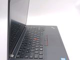 a close up of a laptop computer on a white surface