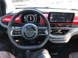 the interior of a car with a steering wheel and dashboard controls