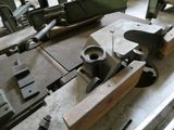 a machine that is working on a piece of wood