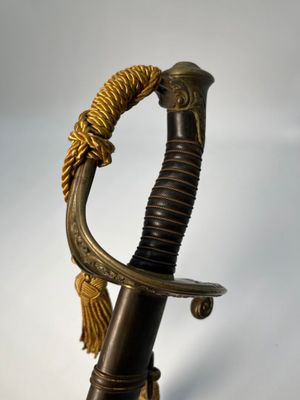 a close up of a sword with a rope on it